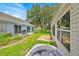A spacious backyard features a patio and landscaping at 1401 Madrigal Ln, Lady Lake, FL 32159