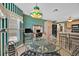 Bright breakfast nook with table, chairs, adjacent to kitchen and work space at 1401 Madrigal Ln, Lady Lake, FL 32159