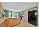 Well-equipped kitchen featuring lots of cabinet space, and a breakfast bar at 1401 Madrigal Ln, Lady Lake, FL 32159