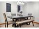 Bright dining area with a modern table, seating for six, and elegant decor at 14325 Manchester Ave, Groveland, FL 34736