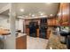 Kitchen featuring granite countertops, stainless steel appliances, and tile floors at 14325 Manchester Ave, Groveland, FL 34736
