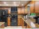 Updated kitchen featuring granite countertops, stainless steel appliances, and tile floors at 14325 Manchester Ave, Groveland, FL 34736
