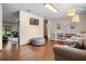 Spacious living room featuring a TV, shelving, and seating, creating a comfortable living space at 14325 Manchester Ave, Groveland, FL 34736