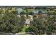 Aerial view of the home with mature trees and landscaping at 1512 Cervantes Pl, Lady Lake, FL 32159