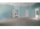 Spacious bedroom features neutral carpet, ceiling fan, and provides access to the bathroom and other rooms at 1512 Cervantes Pl, Lady Lake, FL 32159