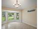 Sunny breakfast nook with bay windows; perfect place to start your day with a view of the yard at 1512 Cervantes Pl, Lady Lake, FL 32159