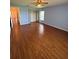 Bedroom with light blue walls, wood floors, and a large closet with sliding doors at 17329 Se 115Th Ter, Summerfield, FL 34491