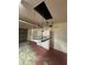 Garage featuring an automatic lift with storage rack at 17329 Se 115Th Ter, Summerfield, FL 34491