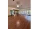 Spacious living room featuring hardwood floors and natural light at 17329 Se 115Th Ter, Summerfield, FL 34491
