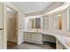 Bathroom featuring a walk-in shower and vanity with countertop space and built in vanity at 1855 Stacey Dr, Mount Dora, FL 32757