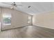 Bright, airy bedroom with wood-look floors and natural light, creating a serene atmosphere at 1855 Stacey Dr, Mount Dora, FL 32757