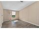 Inviting bedroom featuring modern flooring and ample natural light from a window at 1855 Stacey Dr, Mount Dora, FL 32757