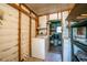 Functional laundry area featuring a washer, with ample storage and shelving at 1855 Stacey Dr, Mount Dora, FL 32757