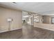 Open-concept living area with views of the dining and kitchen spaces, featuring wood-look flooring at 1855 Stacey Dr, Mount Dora, FL 32757