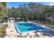 Community swimming pool with lounge chairs and a shaded gazebo at 1855 Stacey Dr, Mount Dora, FL 32757