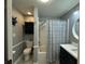 Charming bathroom with a shower-tub combo featuring a stylish blue and white shower curtain at 219 Magnolia Cir, Eustis, FL 32726