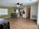 Bright, open kitchen and living area featuring an island with bar seating and modern appliances at 219 Magnolia Cir, Eustis, FL 32726