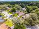 Aerial view of a single-Gathering home surrounded by lush trees and landscaping in a suburban neighborhood at 2389 Grand Poplar St, Ocoee, FL 34761