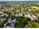 An elevated view highlights the neighborhood's mature trees surrounding the home in a picturesque setting at 2389 Grand Poplar St, Ocoee, FL 34761
