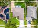 Aerial view of the home showcasing the backyard with a pool and deck, and the neighboring houses at 2389 Grand Poplar St, Ocoee, FL 34761