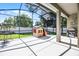 Spacious screened-in back porch with grill and playhouse overlooking yard at 2389 Grand Poplar St, Ocoee, FL 34761