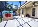 Enclosed back porch featuring patio furniture and playhouse at 2389 Grand Poplar St, Ocoee, FL 34761
