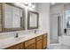 Bright bathroom showcasing a double sink vanity, soaking tub, and separate tiled shower at 2389 Grand Poplar St, Ocoee, FL 34761