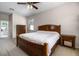 Comfortable bedroom with neutral carpet, ceiling fan and a view towards the bathroom at 2389 Grand Poplar St, Ocoee, FL 34761
