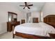 Spacious bedroom featuring a ceiling fan, carpet flooring, and ample closet space at 2389 Grand Poplar St, Ocoee, FL 34761
