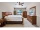 Neutral bedroom with carpet, wooden furniture, and window view at 2389 Grand Poplar St, Ocoee, FL 34761