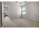 Bedroom boasts plush carpeting, a ceiling fan, and ample natural light at 2389 Grand Poplar St, Ocoee, FL 34761