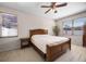 Cozy bedroom featuring a ceiling fan and natural light streaming through the windows at 2389 Grand Poplar St, Ocoee, FL 34761