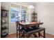 Dining room features a wooden dining table with bench, unique shelving, and tile floors at 2389 Grand Poplar St, Ocoee, FL 34761