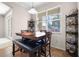 Cozy dining area features stylish wooden table with bench seating and tile floors at 2389 Grand Poplar St, Ocoee, FL 34761