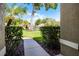 Inviting walkway to front door lined with verdant bushes. Mature trees provide shade in this picturesque setting at 2389 Grand Poplar St, Ocoee, FL 34761