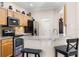 Kitchen featuring stainless steel appliances, tile floor and breakfast bar seating at 2389 Grand Poplar St, Ocoee, FL 34761