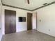 Bedroom with a window, closet, television mounted on the wall, and access to a hallway at 2450 W Lake Dr, Deland, FL 32724
