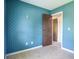 Bedroom with a blue patterned wallpaper and access to a hallway at 2450 W Lake Dr, Deland, FL 32724