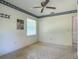 Bedroom with floral trim, ceiling fan, window, and wall art at 2450 W Lake Dr, Deland, FL 32724