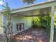 Attached carport area with wooden work table and views of surrounding landscape at 2450 W Lake Dr, Deland, FL 32724