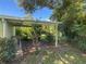 Covered patio area with views of the lush yard, offering a serene space for outdoor enjoyment at 2450 W Lake Dr, Deland, FL 32724