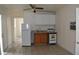 Functional kitchen features bright cabinets, appliances, and a tile floor at 2611 Hiawatha Ave, Sanford, FL 32773