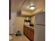 Features modern appliances, wood cabinets, and tile floors at 2611 Hiawatha Ave, Sanford, FL 32773