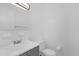 This bathroom features a modern vanity, mirror, and a neutral color palette at 302 W Rose Ln, Lady Lake, FL 32159