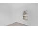 An empty bedroom with a neutral color palette is flooded with natural light from the window at 302 W Rose Ln, Lady Lake, FL 32159
