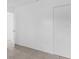 This empty bedroom features a neutral color palette and built-in closet space at 302 W Rose Ln, Lady Lake, FL 32159