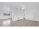 Spacious open living room, featuring an open floor plan, and neutral color palette at 302 W Rose Ln, Lady Lake, FL 32159