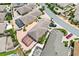 Aerial view of homes with screened-in pools, manicured lawns, and well-maintained landscaping at 3105 Carrollton Ct, The Villages, FL 32162