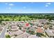 Aerial view of a home with a screened lanai located in a neighborhood with golf course access at 3105 Carrollton Ct, The Villages, FL 32162