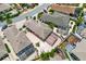 Aerial view of the home featuring a screened pool, lush landscaping, and charming neighborhood at 3105 Carrollton Ct, The Villages, FL 32162